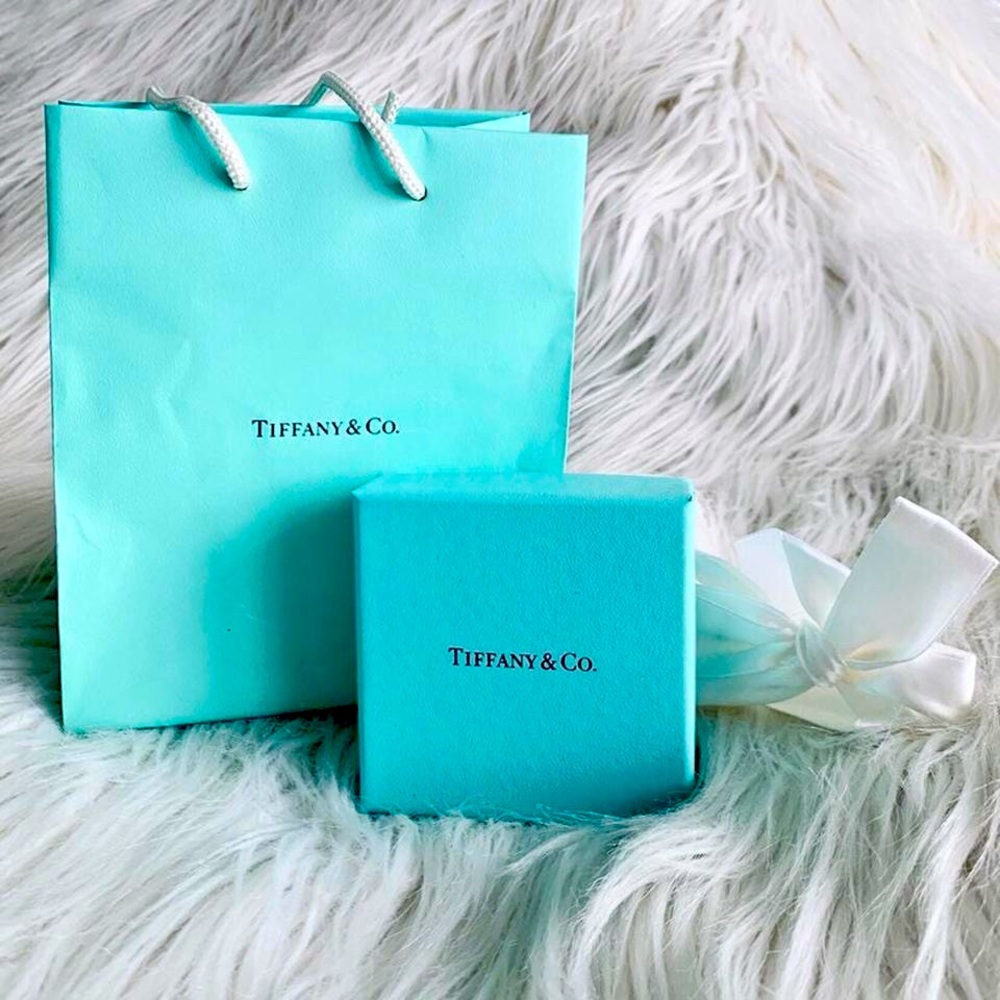 Tiffany & Co. box with silk white ribbon and bag